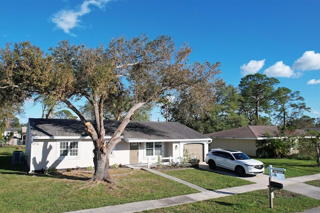 view of front facade with a garage and a front lawn