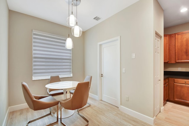 dining area featuring light wood-type flooring