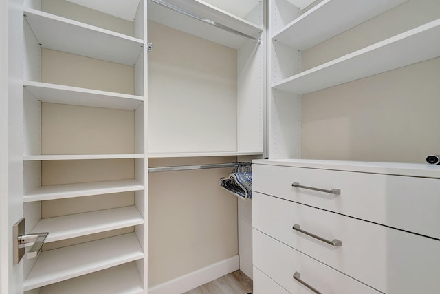 walk in closet featuring light hardwood / wood-style floors