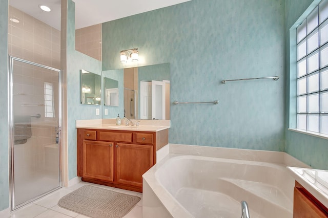 bathroom with vanity, tile patterned flooring, and separate shower and tub