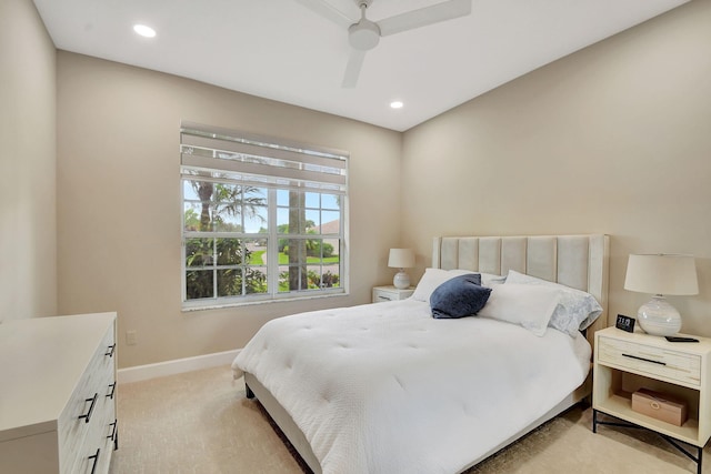 bedroom featuring ceiling fan and light carpet