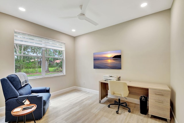 office area with light hardwood / wood-style floors and ceiling fan