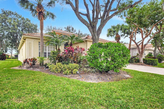 view of home's exterior with a lawn