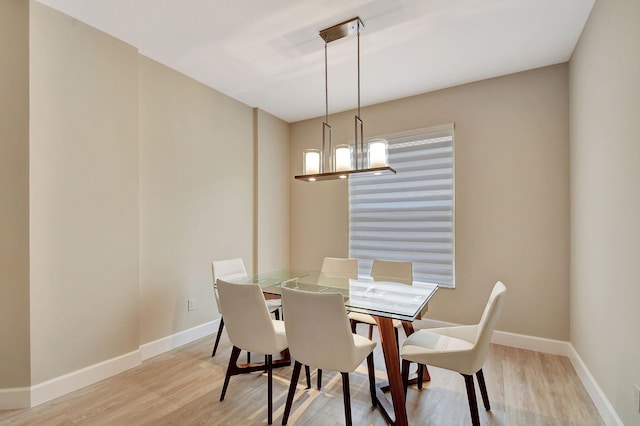 dining space featuring light wood-type flooring