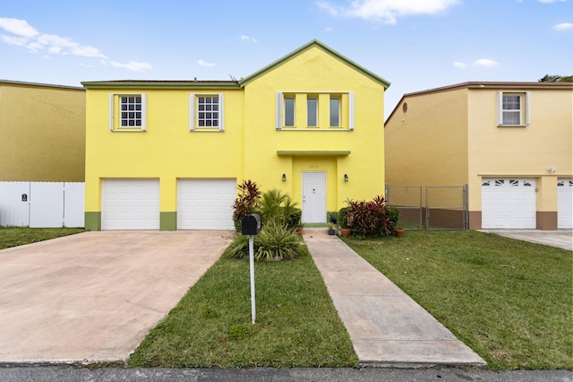 view of front of house featuring a garage and a front yard