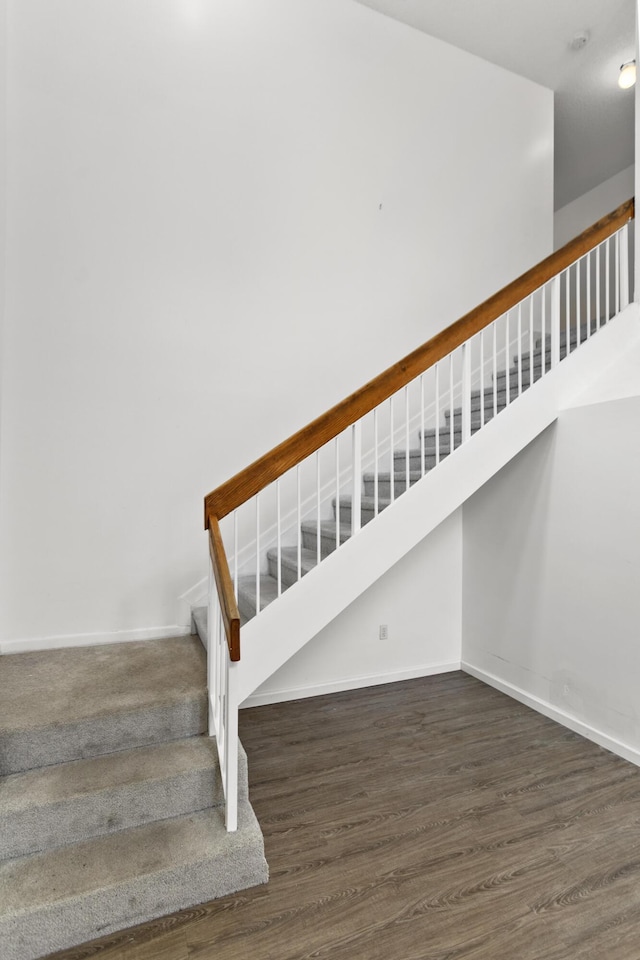 stairway featuring hardwood / wood-style floors