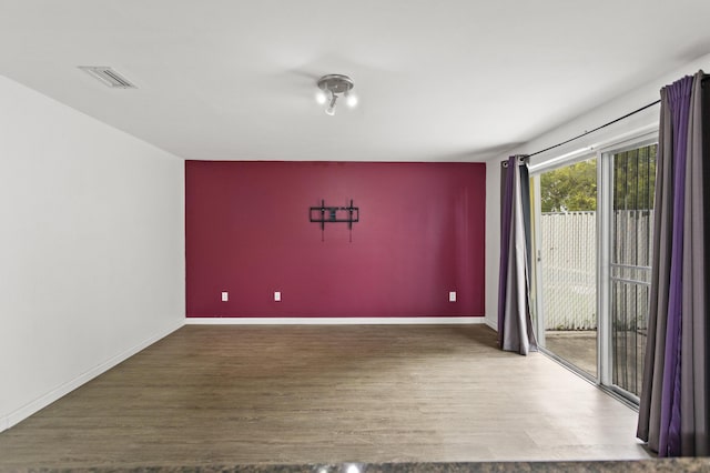 unfurnished room featuring hardwood / wood-style floors