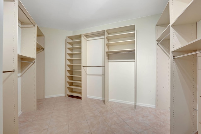 spacious closet with light tile patterned flooring