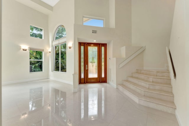 entrance foyer featuring a high ceiling