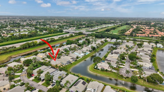 birds eye view of property featuring a water view