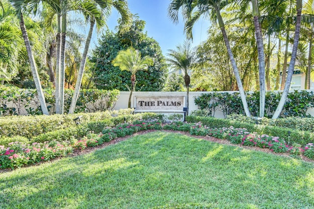 community / neighborhood sign with a lawn