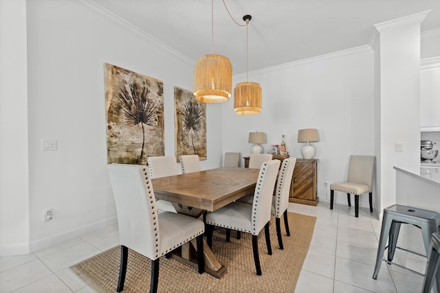 tiled dining room featuring crown molding