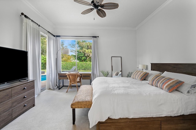 carpeted bedroom with ceiling fan and ornamental molding