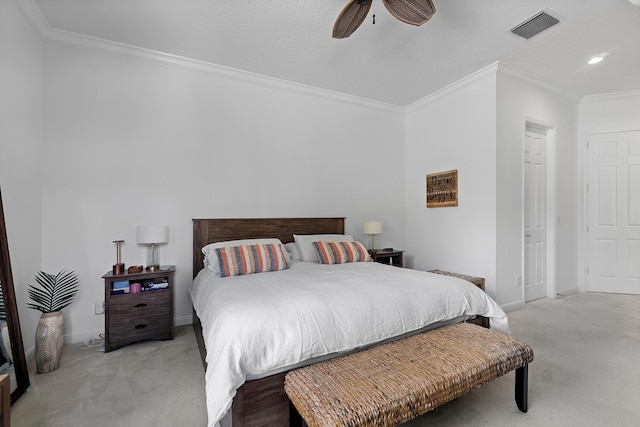 carpeted bedroom featuring ceiling fan and ornamental molding