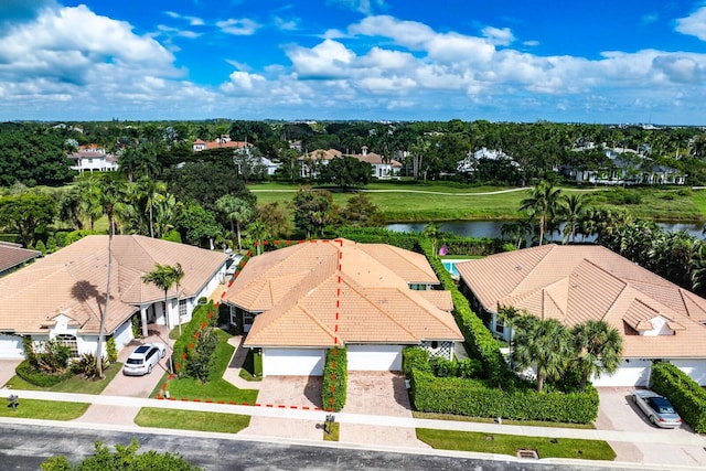 bird's eye view with a water view