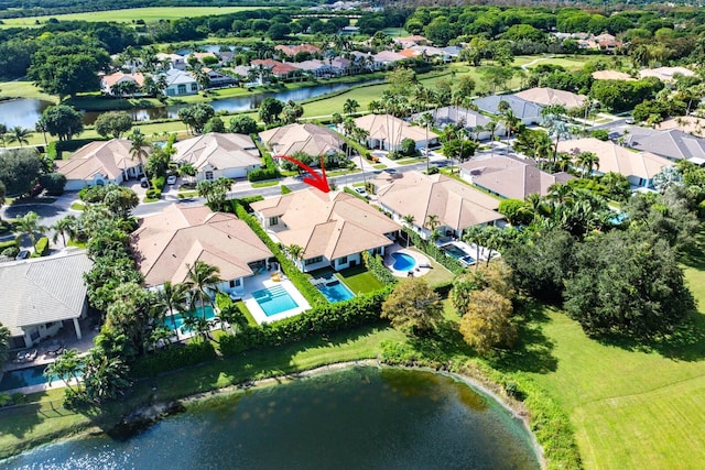 drone / aerial view with a water view