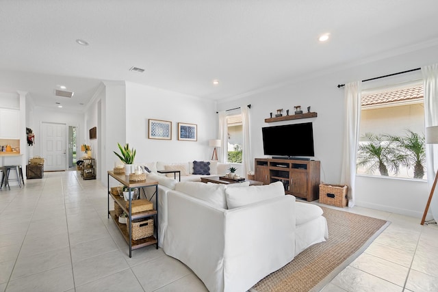 tiled living room featuring crown molding