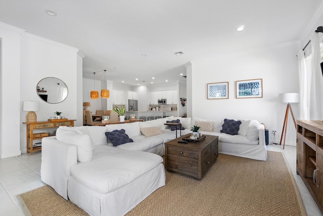 tiled living room featuring ornamental molding