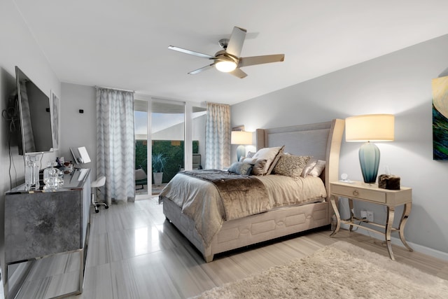 bedroom with ceiling fan and access to outside