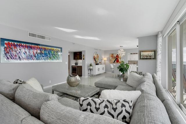 living room featuring plenty of natural light and wine cooler