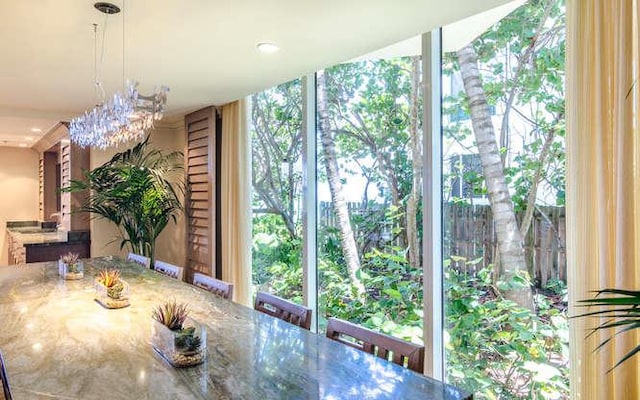 unfurnished dining area featuring a notable chandelier