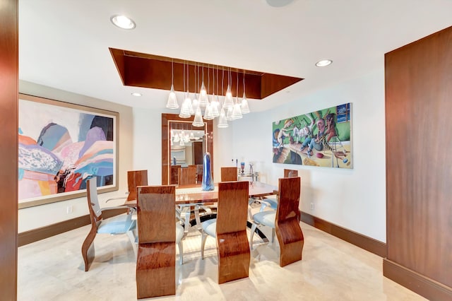 dining space with a chandelier