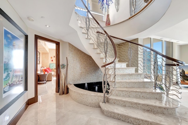 staircase featuring a fireplace