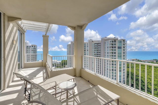 balcony featuring a water view