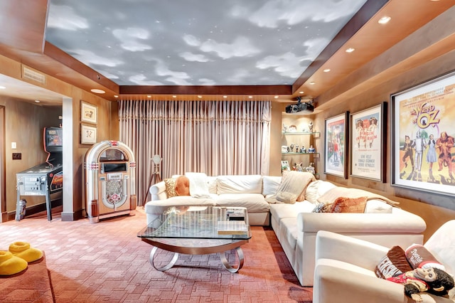 cinema room with a tray ceiling