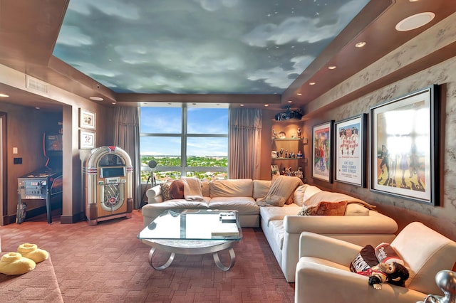 living room featuring a tray ceiling