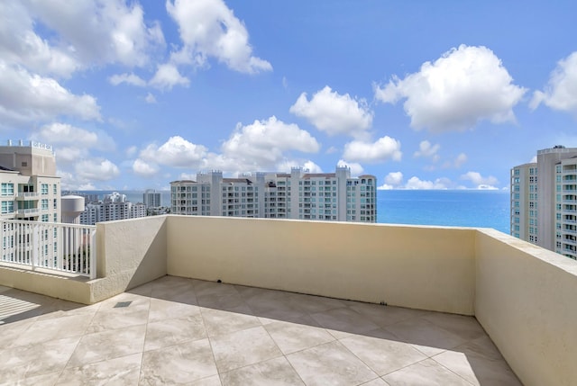 balcony featuring a water view