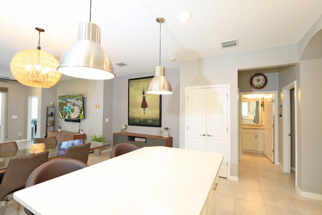 dining area featuring light tile patterned flooring