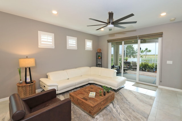 tiled living room with ceiling fan