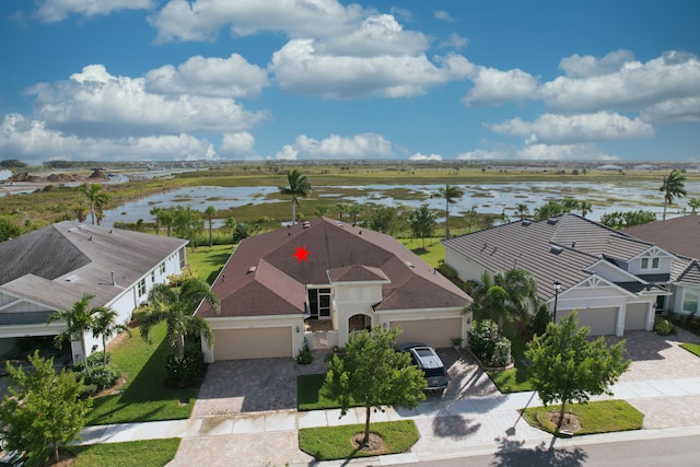 birds eye view of property with a water view