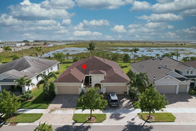 birds eye view of property with a water view