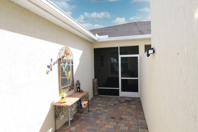 doorway to property with a patio area