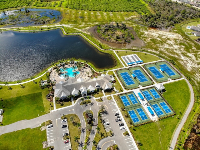 birds eye view of property with a water view