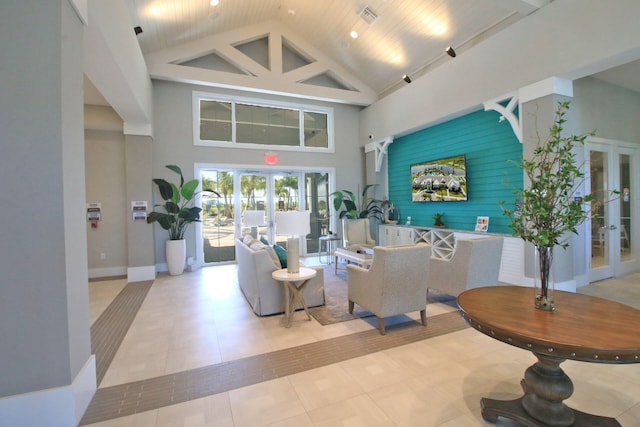 tiled living room with high vaulted ceiling, wood ceiling, bar, and french doors