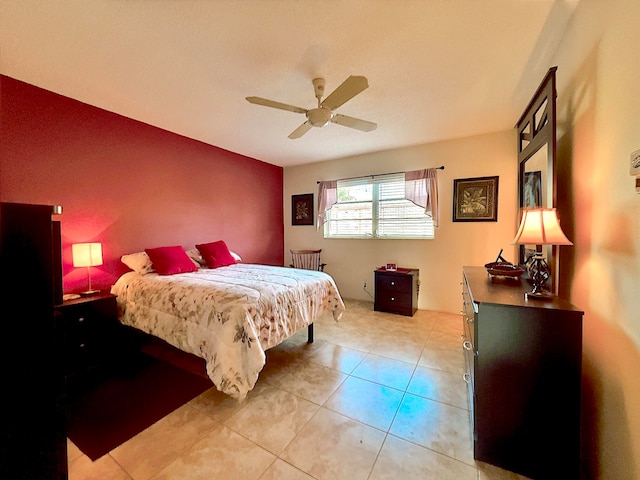 tiled bedroom featuring ceiling fan