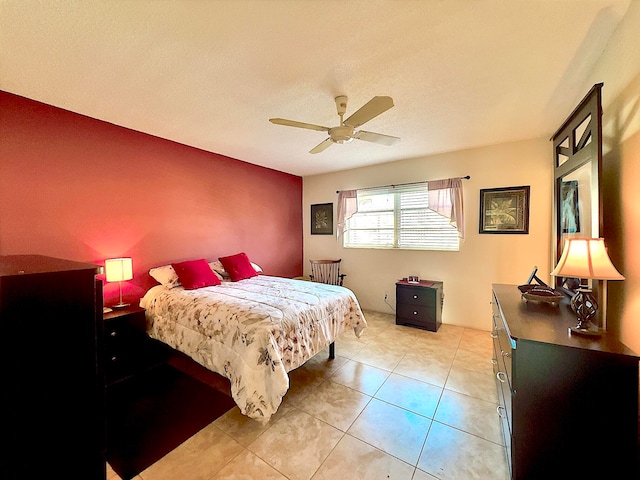 bedroom featuring ceiling fan and light tile patterned floors