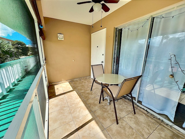 balcony featuring ceiling fan and a patio area