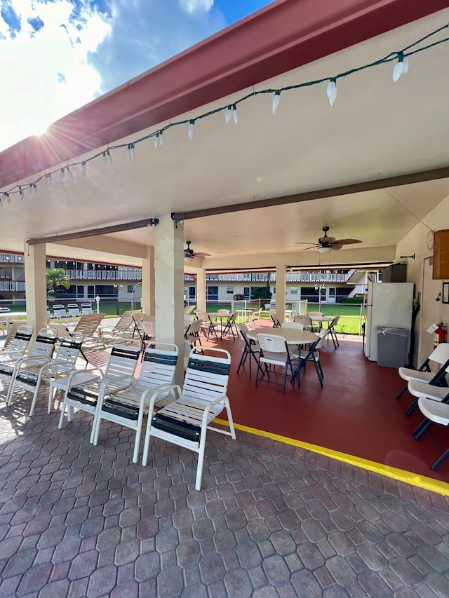 view of patio featuring ceiling fan