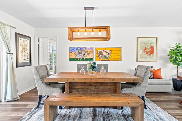 dining area featuring wood-type flooring