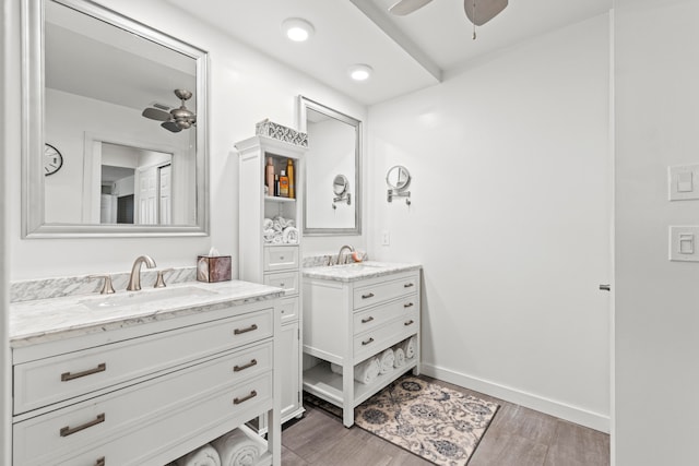 bathroom featuring hardwood / wood-style flooring, ceiling fan, and vanity