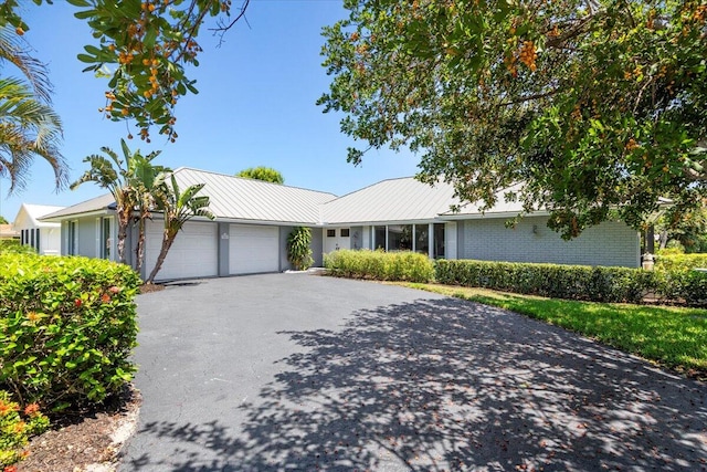 ranch-style home with a garage