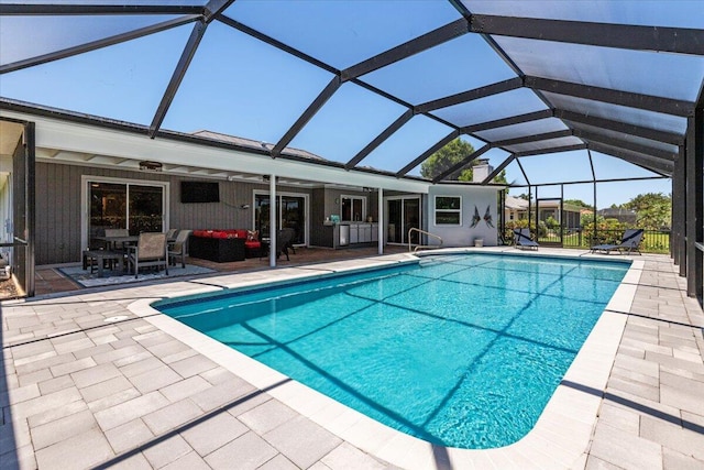 view of swimming pool featuring an outdoor hangout area, a patio area, a lanai, and ceiling fan