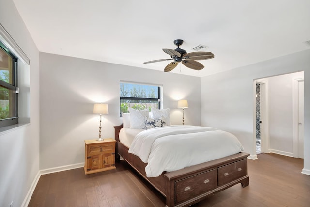 bedroom featuring ceiling fan and dark hardwood / wood-style flooring