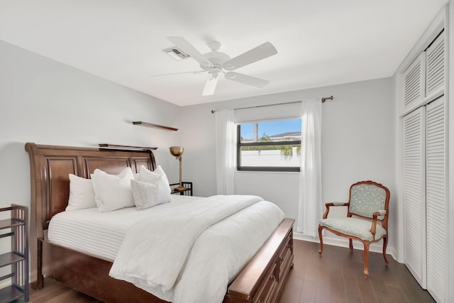 bedroom featuring a closet, ceiling fan, and dark wood-type flooring