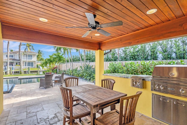 view of patio / terrace featuring area for grilling, ceiling fan, and a grill