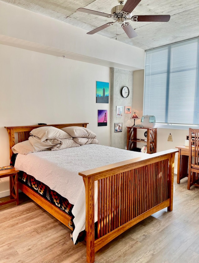 bedroom featuring ceiling fan and wood-type flooring